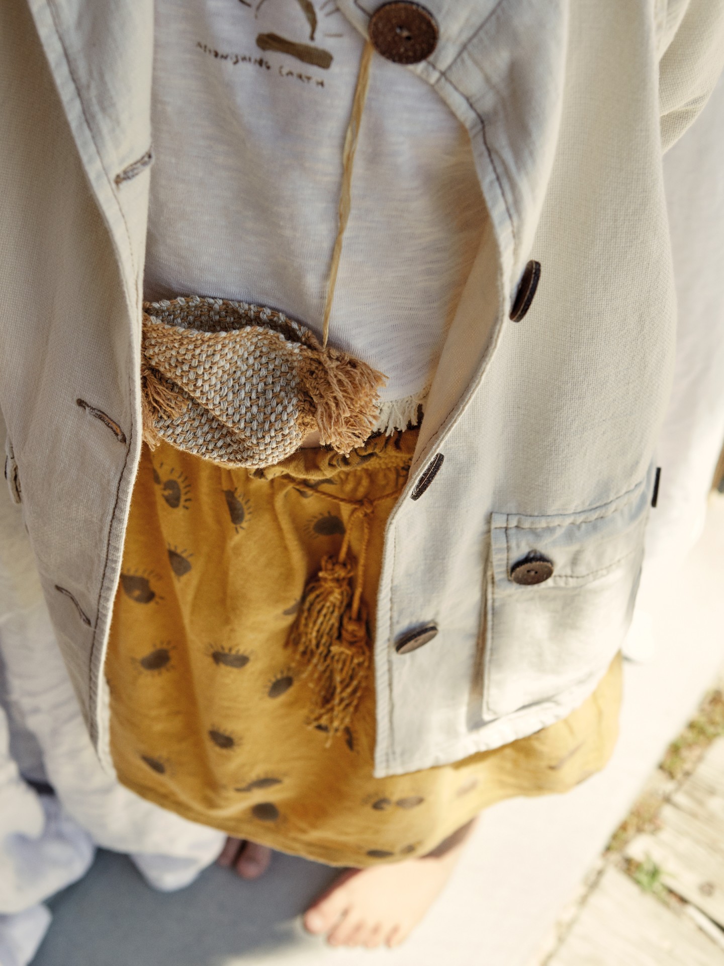 Casaco com bolsos e cinto