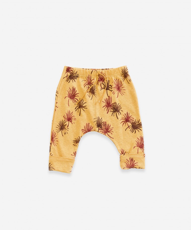 Trousers with palmtree print