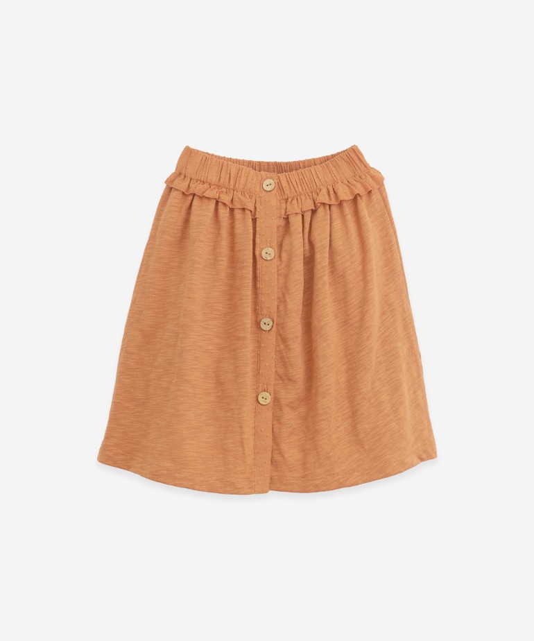 Skirt with button opening