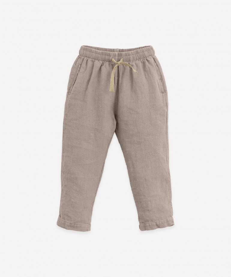 Linen trousers with adjustable cord
