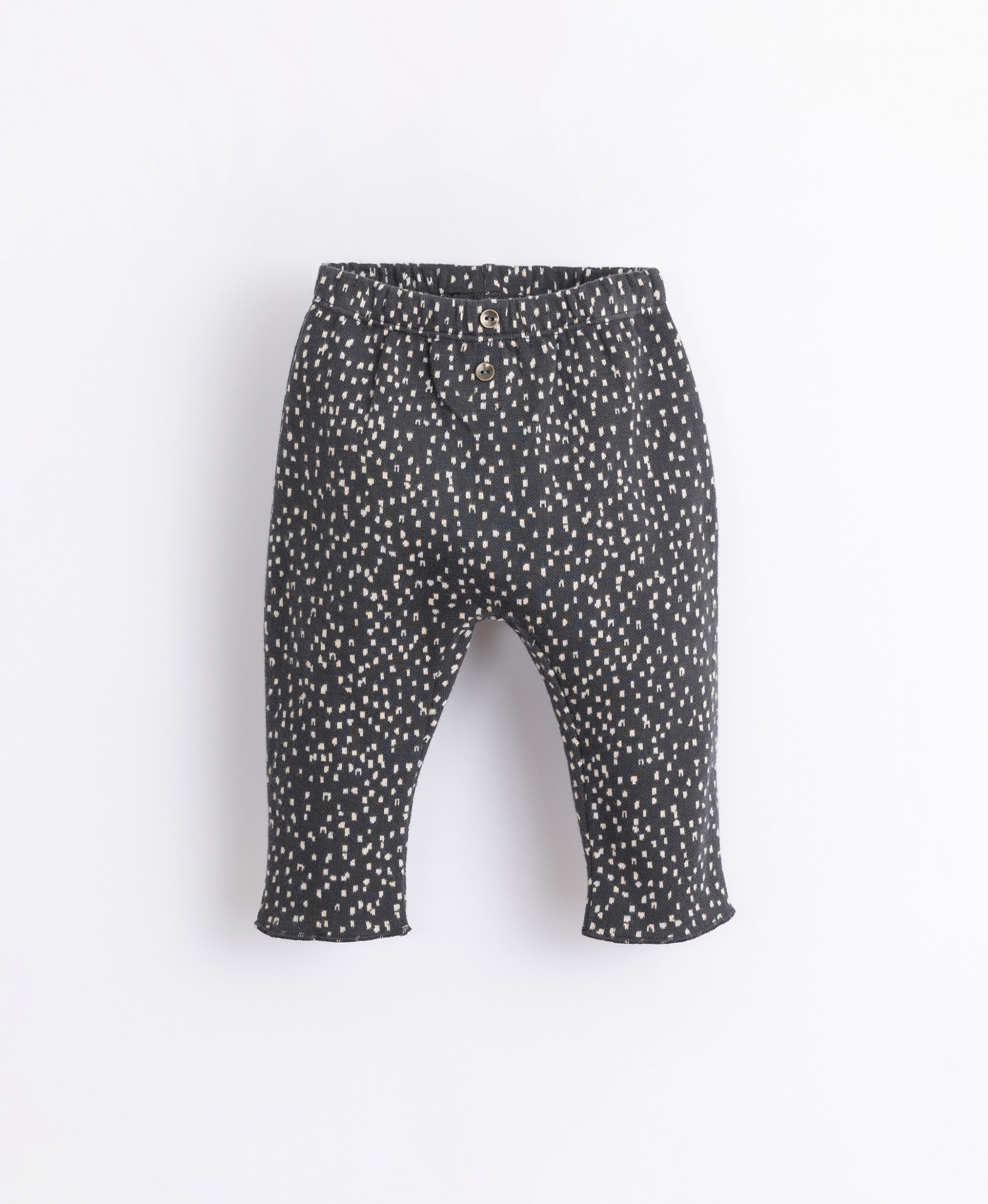 Printed trousers with decorative buttons | Illustration