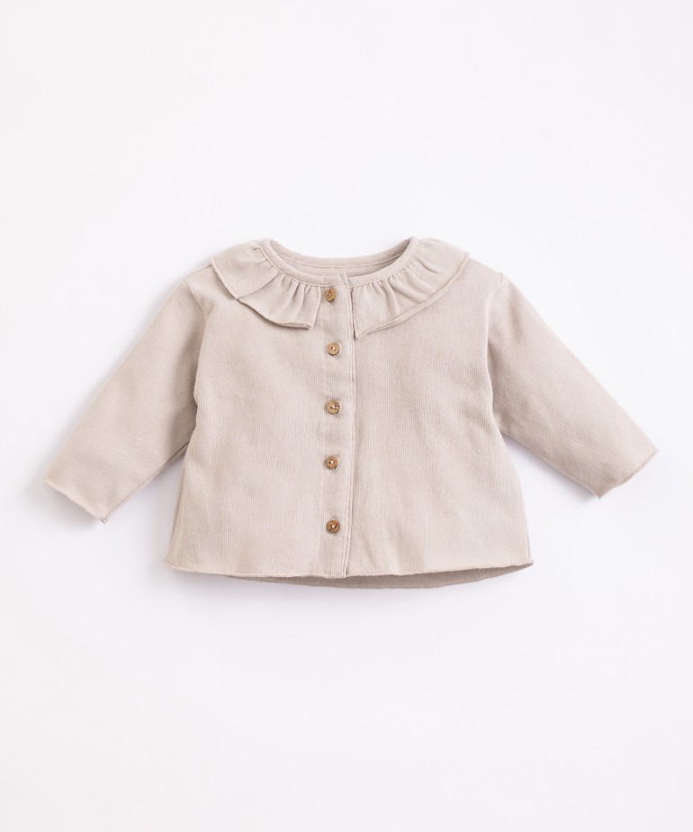 Jacket with frill at the neck