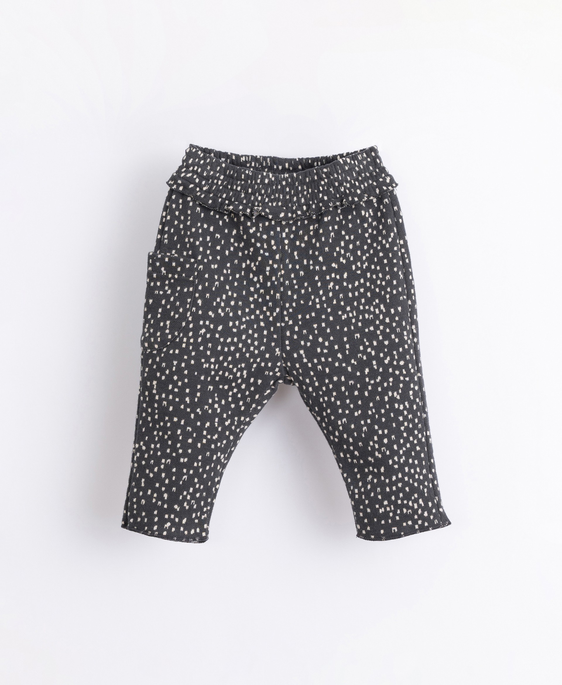 Trousers in organic cotton with a frill | Illustration