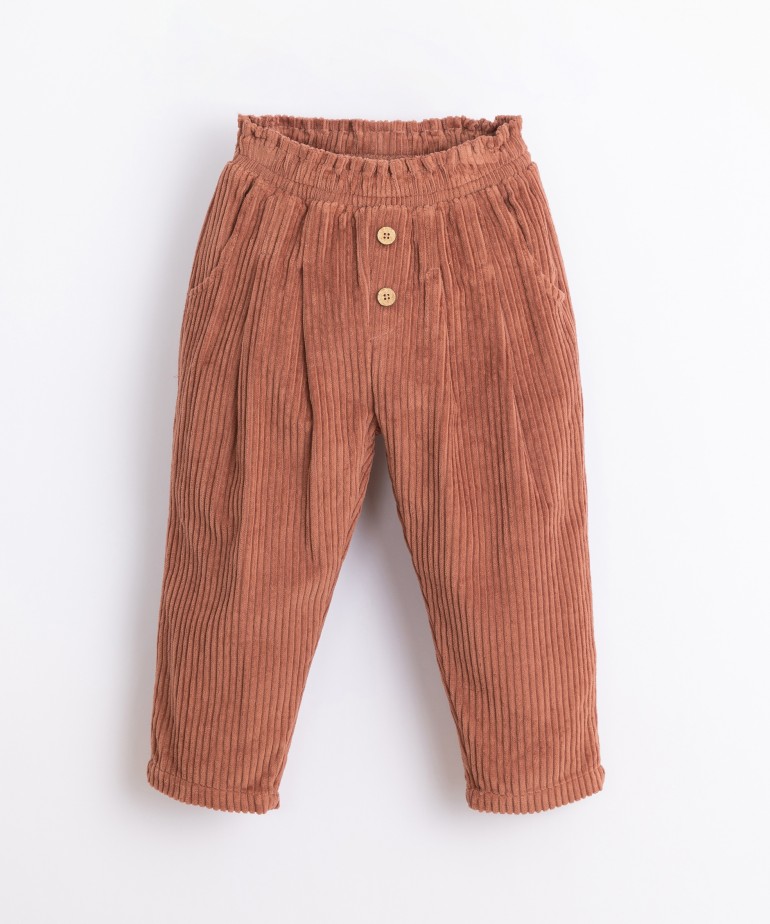 Corduroy trousers with decorative buttons