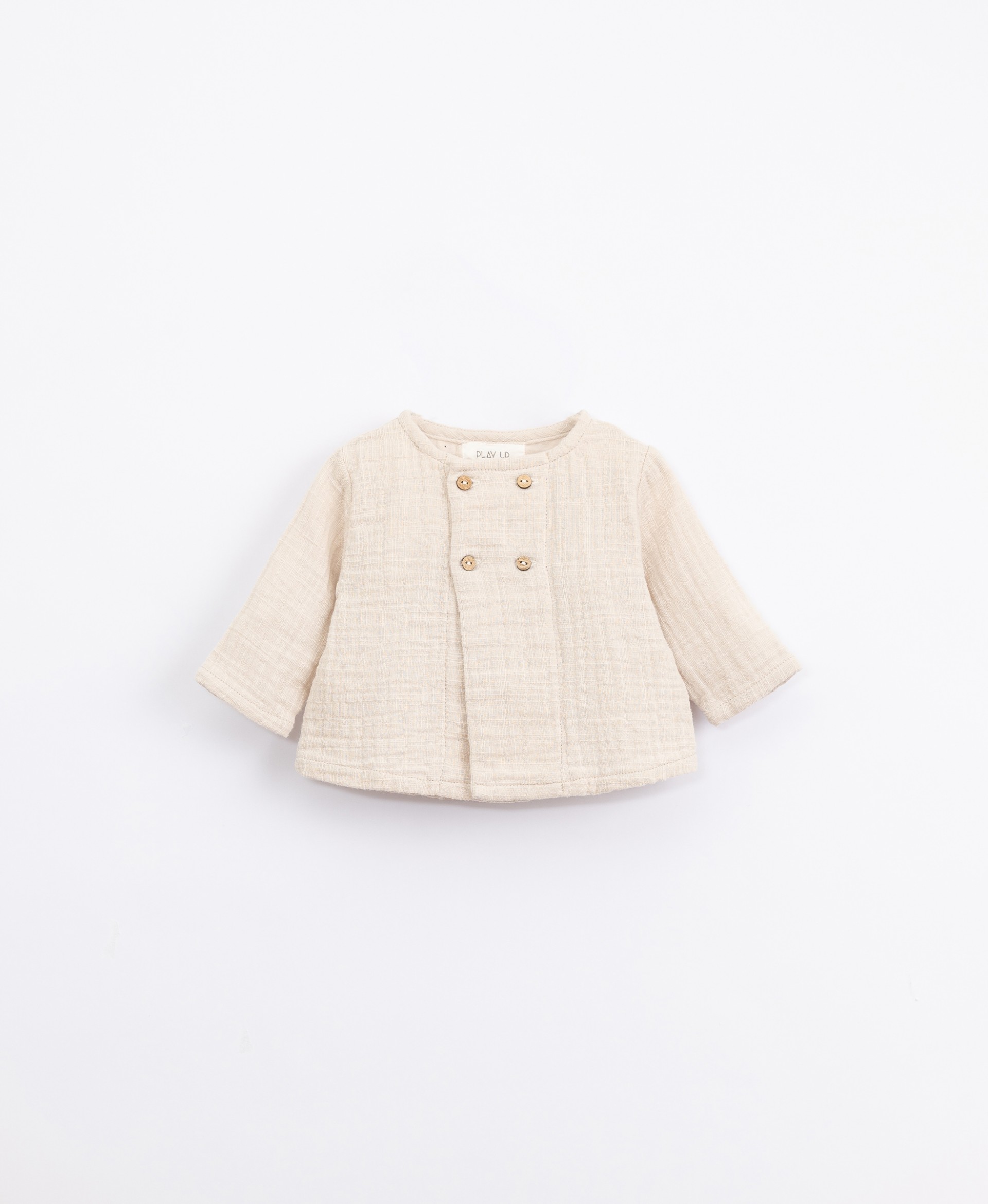 Cotton jersey with coconut buttons| Illustration