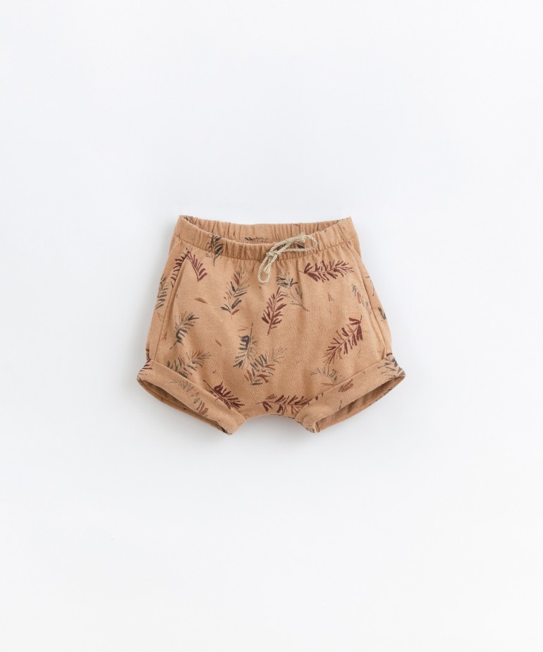 Jersey knit shorts with fir tree print