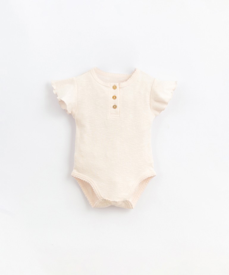 Body in organic cotton with ruffle on the shoulders