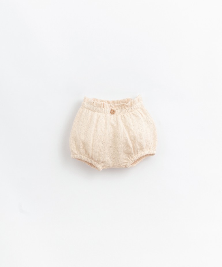 Pantalones cortos de algodón orgánico con botón decorativo 