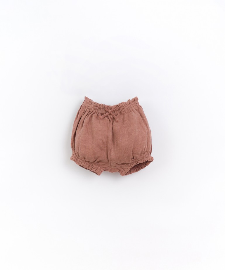 Linen shorts with decorative bow