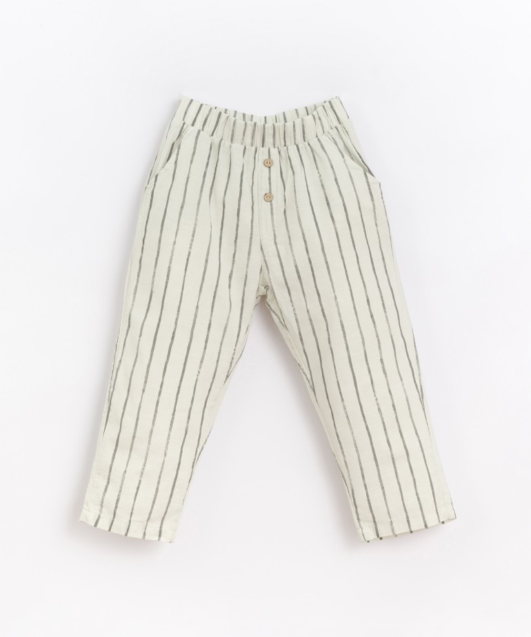 Fabric pants with decorative buttons