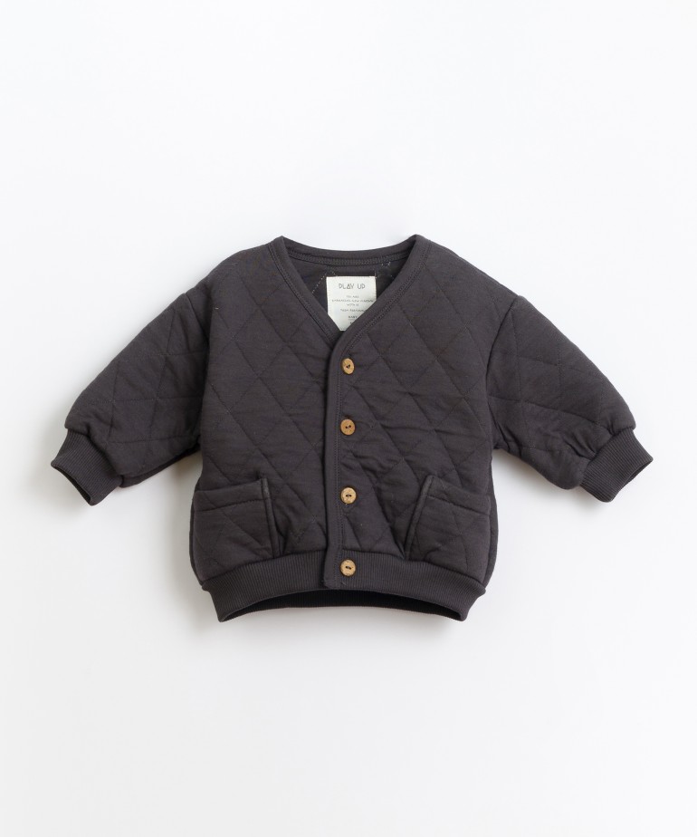 Padded jacket in organic cotton and recycled polyester