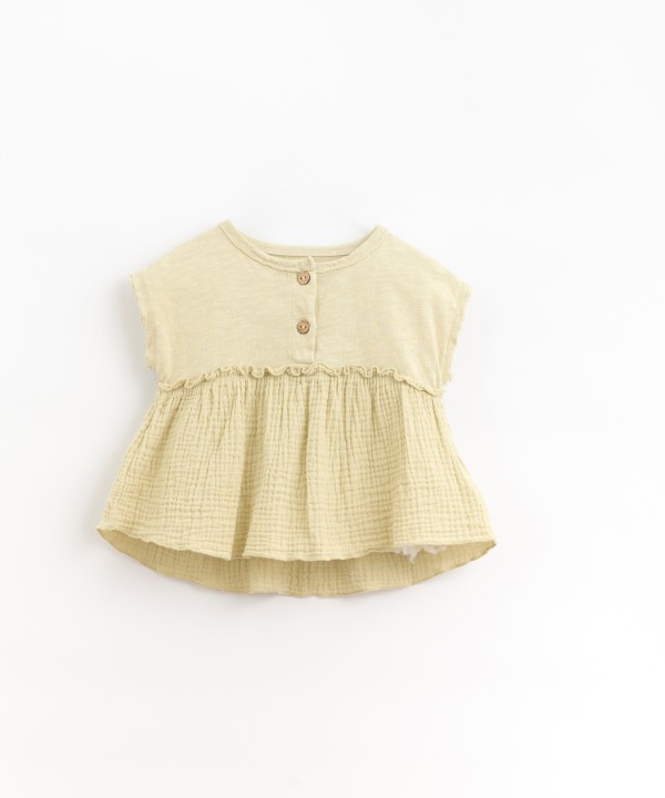 Tunic with coconut button opening