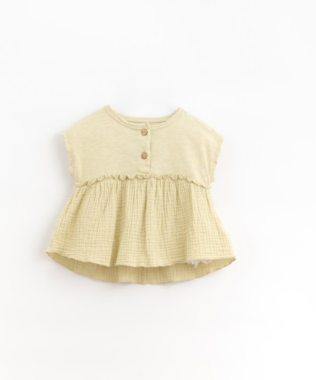 Tunic with coconut button opening