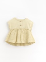 Tunic with coconut button opening