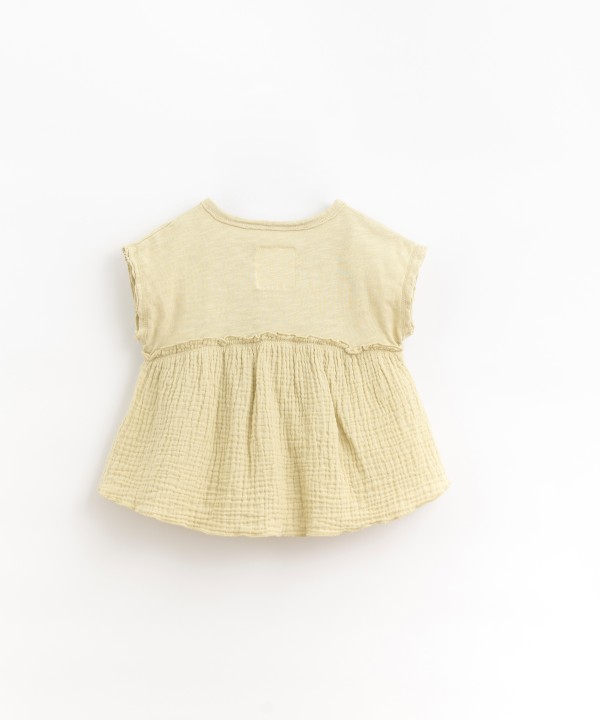 Tunic with coconut button opening