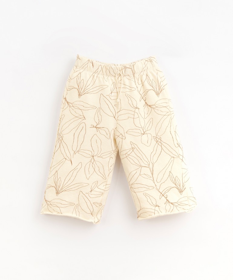 Jersey stitch trousers with sage leaves print