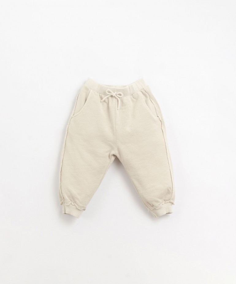 Jersey stitch trousers with decorative cord