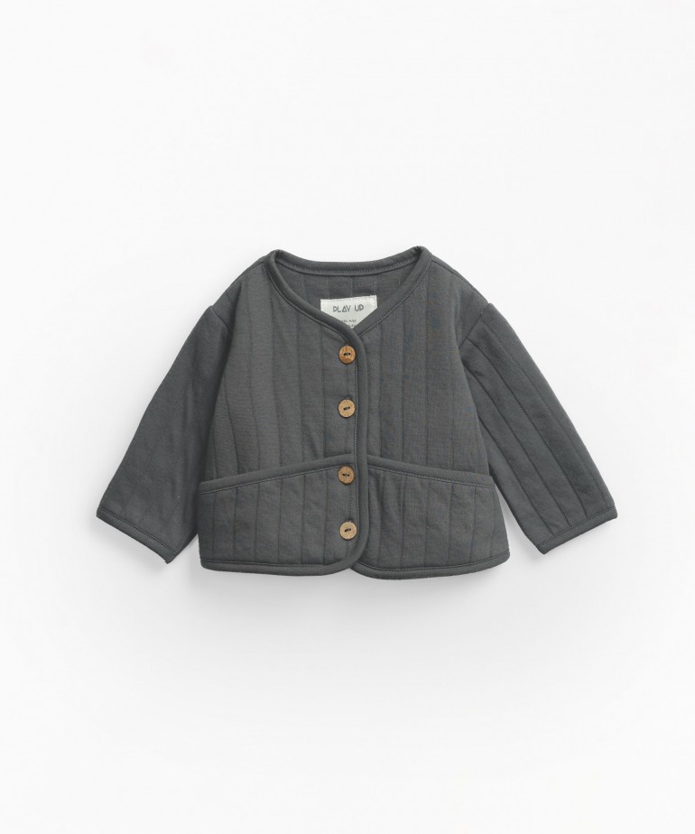 Padded jacket with coconut buttons
