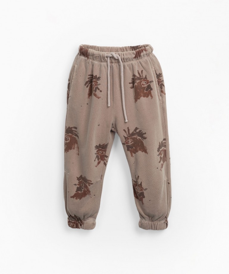 Jersey stitch trousers with roosters print