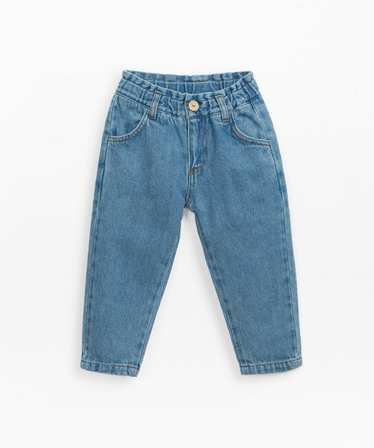 Denim trousers with coconut button opening