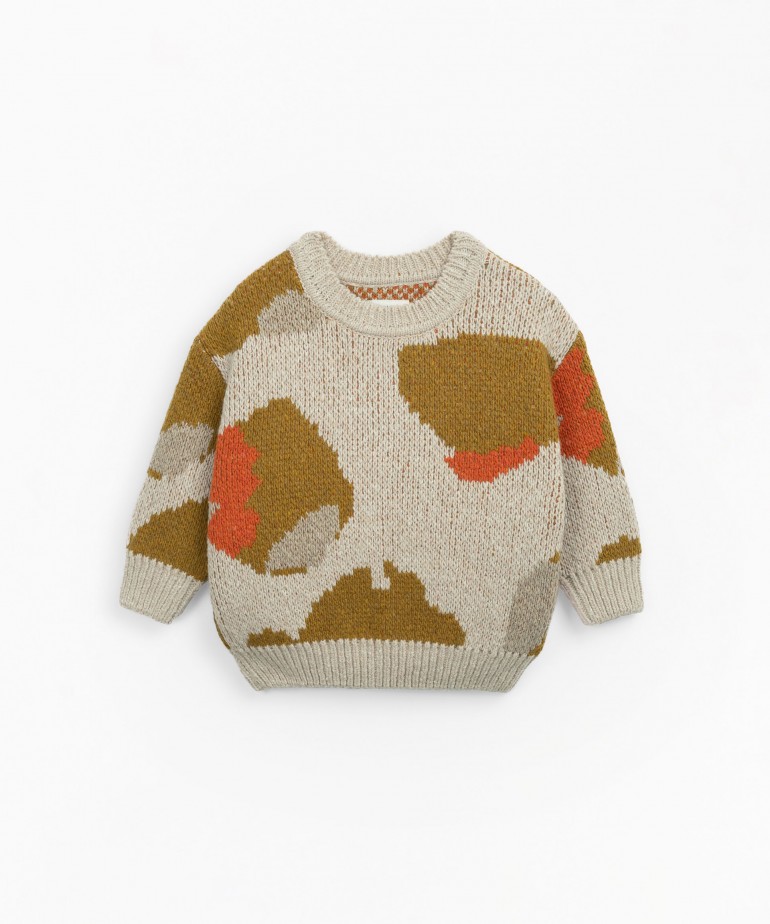 Knitted sweater with abstract pattern