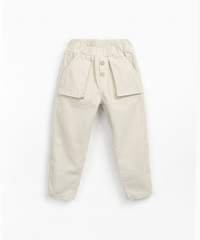 Corduroy trousers with decorative coconut buttons