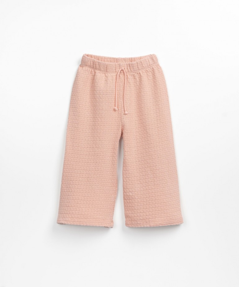 Organic cotton trousers with decorative drawstring