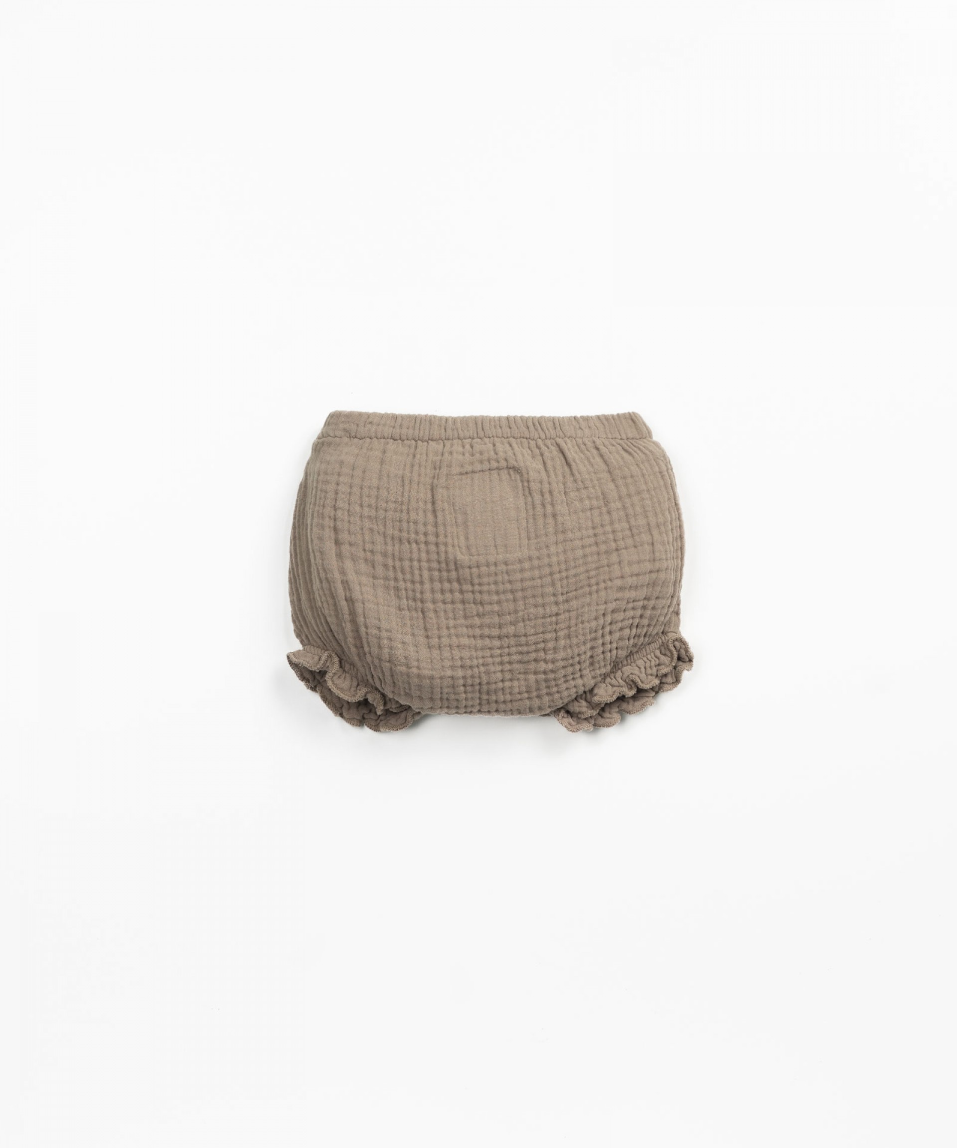 Pantaloncini con bottone decorativo in cocco | Textile Art