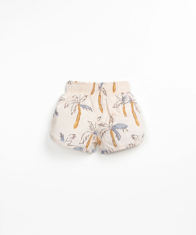 Calo de banho com estampado de palmeiras