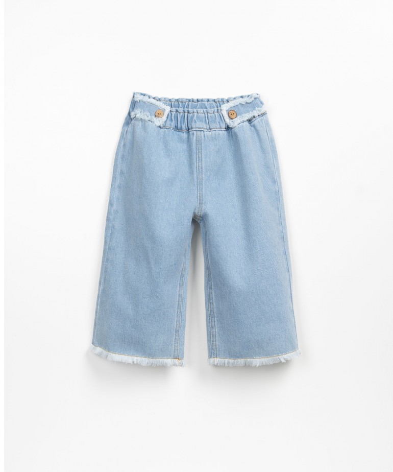 Denim trousers with frayed details