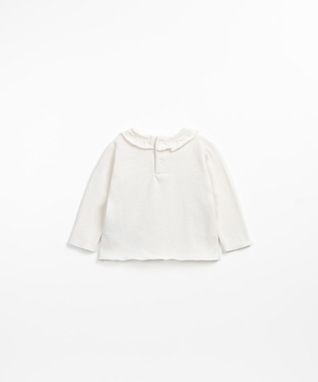 T-shirt con volant e apertura sulla schiena