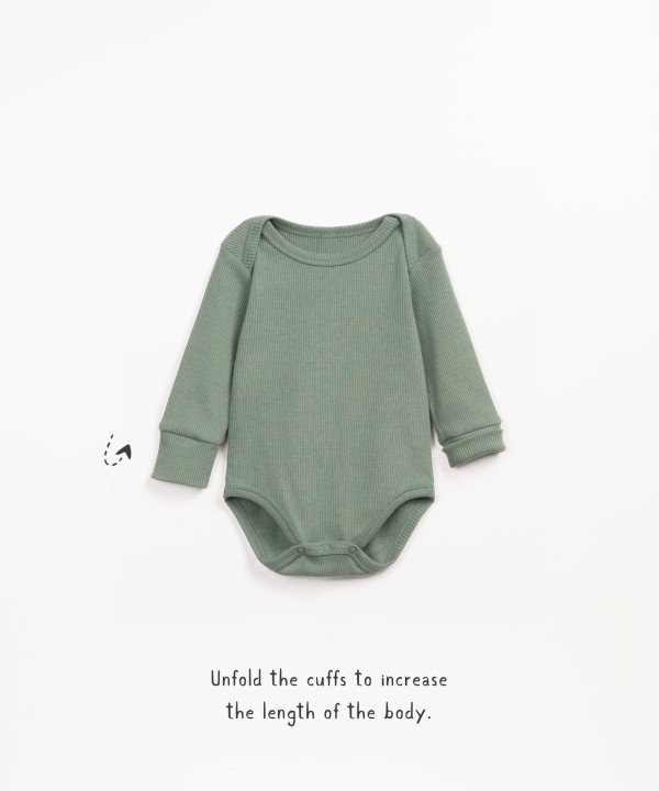 Bodysuit with double breasted shoulder