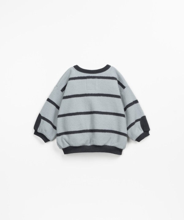 Sweater in a mixture of natural fibers and recycled fibers