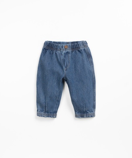 Denim pants with decorative button