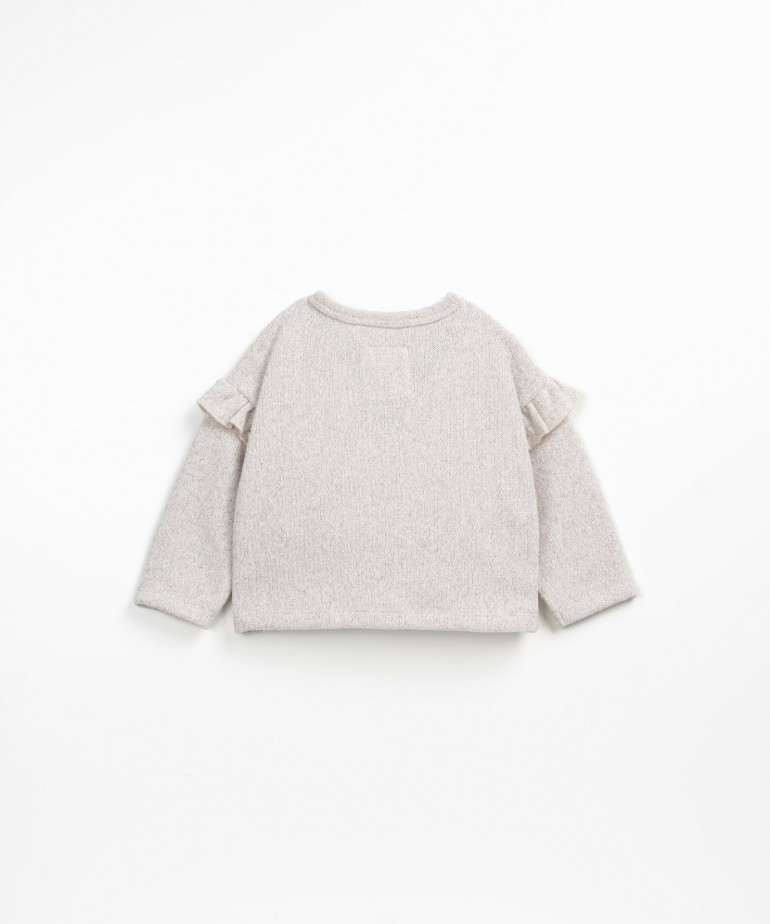 Golfino con volant sulle maniche