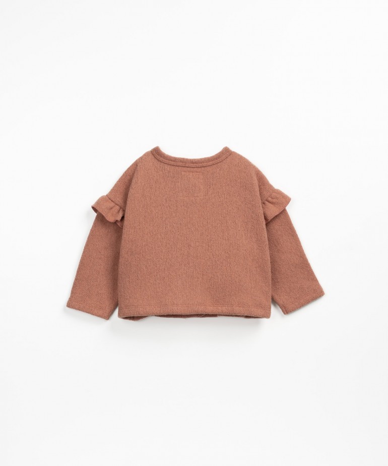 Golfino con volant sulle maniche