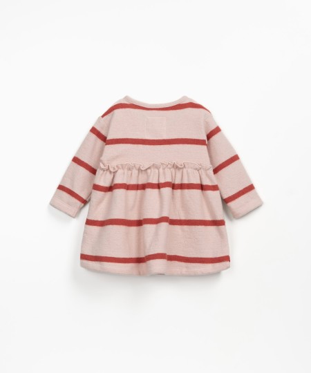 Striped dress with ruffles at the waist