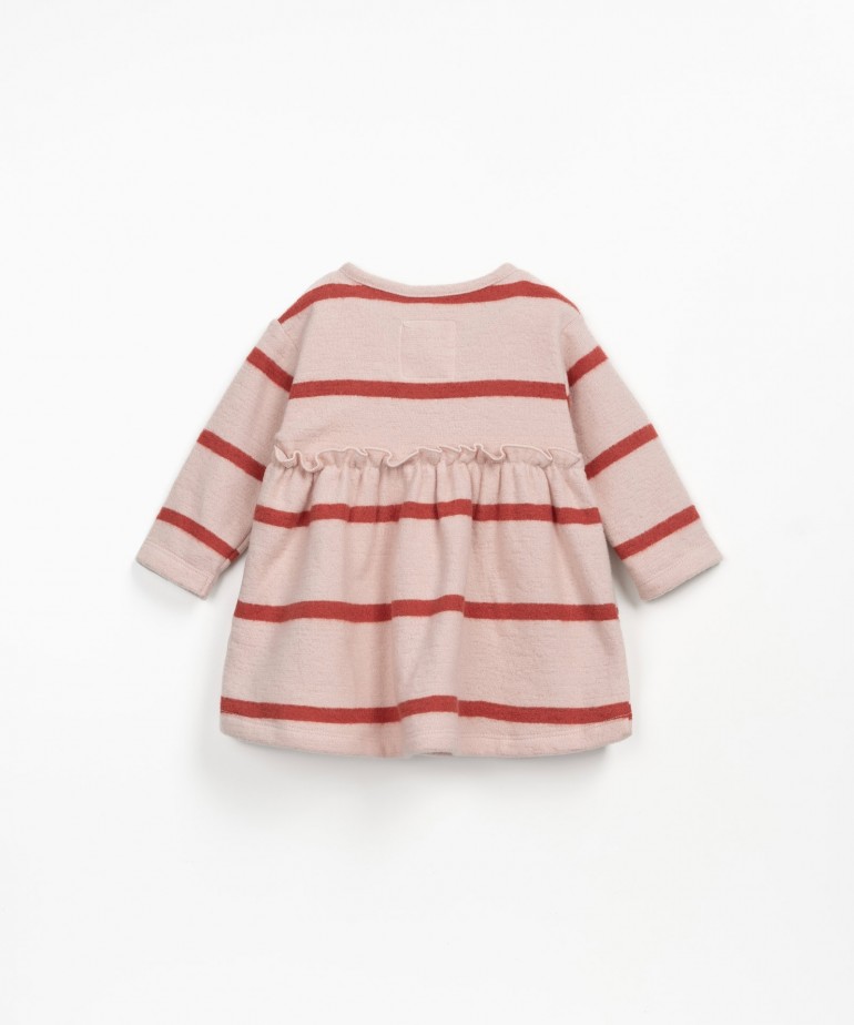 Striped dress with ruffles at the waist