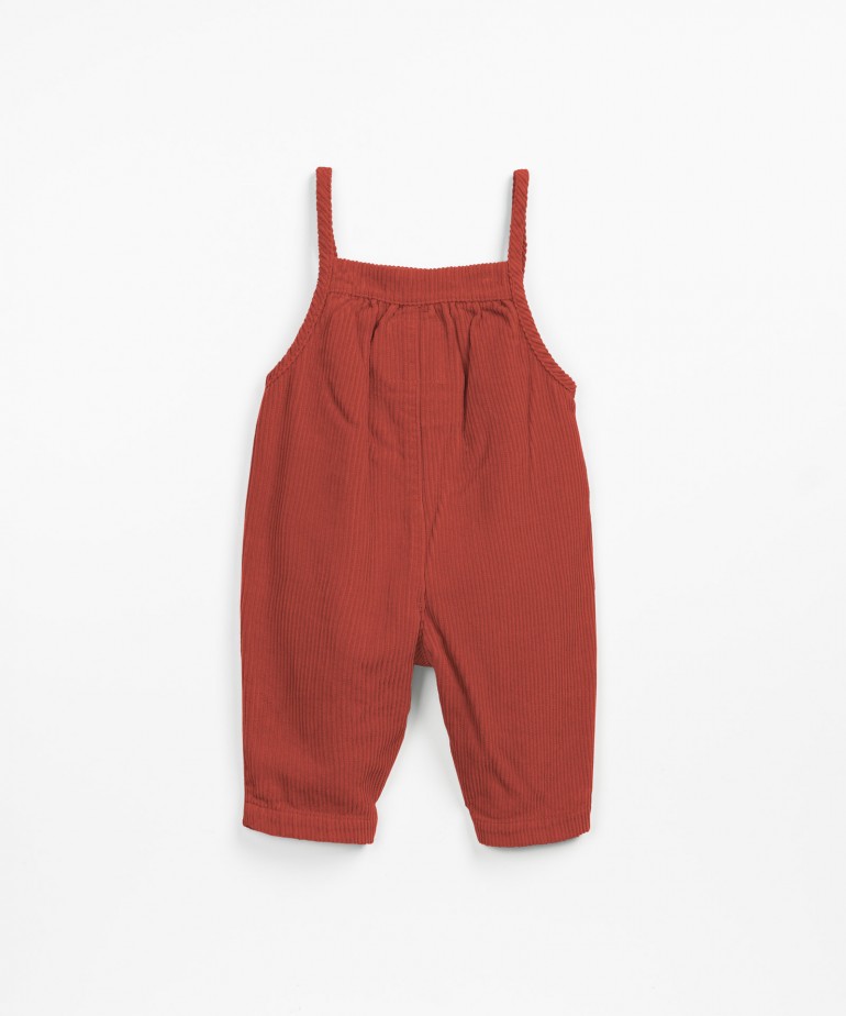 Corduroy jumpsuit with frill on the chest