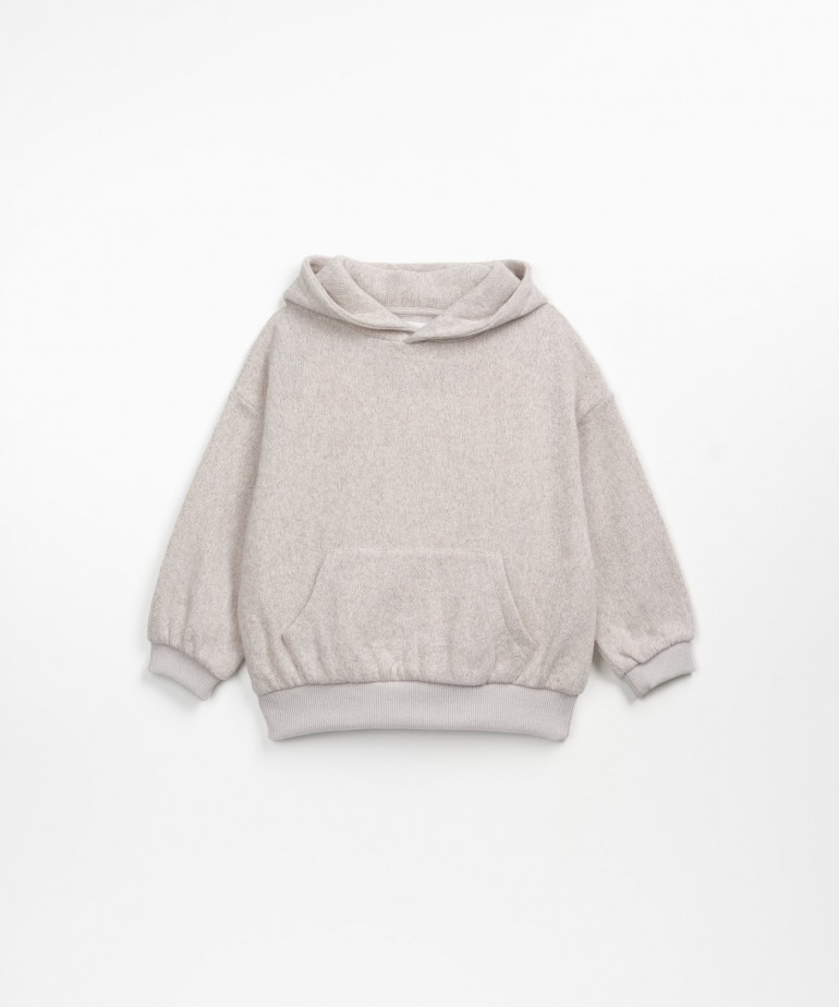 Sweater with hoodie and inner carding