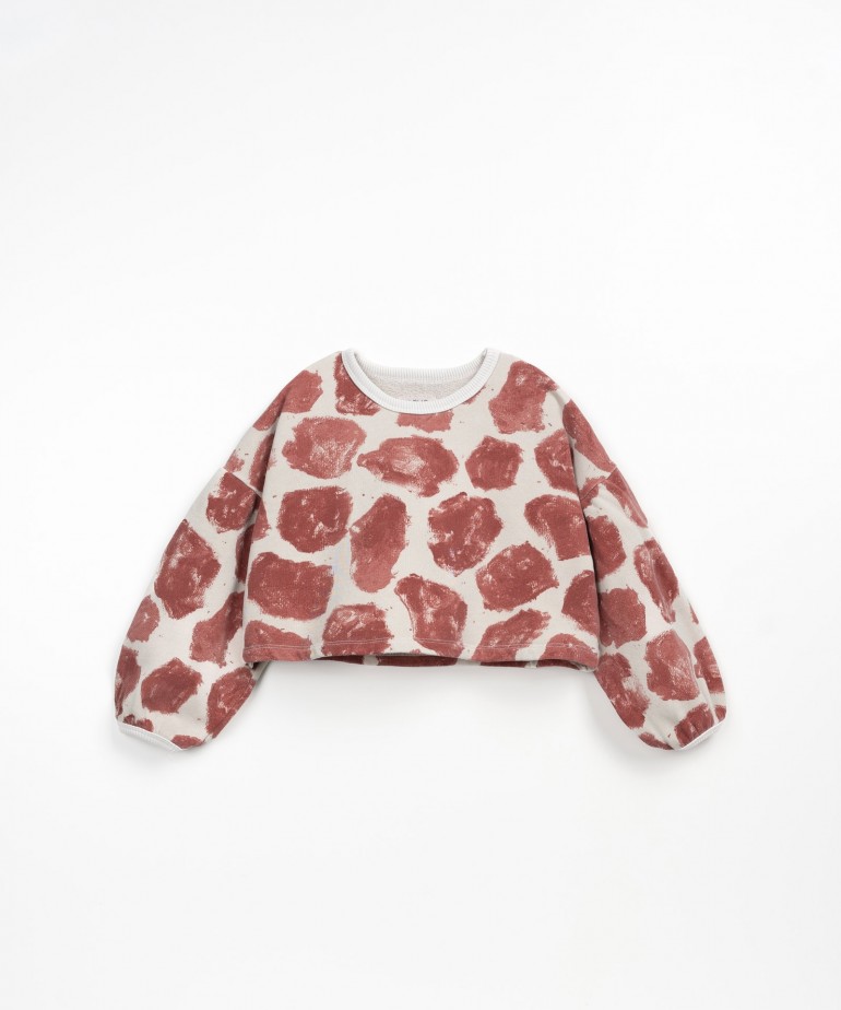 Sweater in natural fibers with giraffe spots print 