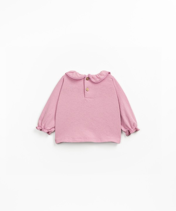 Knitted sweater with a blend of organic and recycled cotton