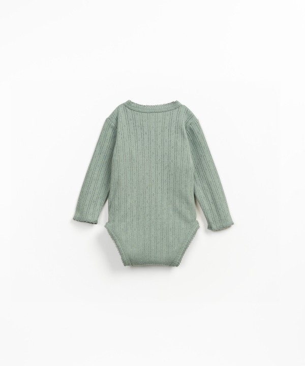 Bodysuit with crossover opening