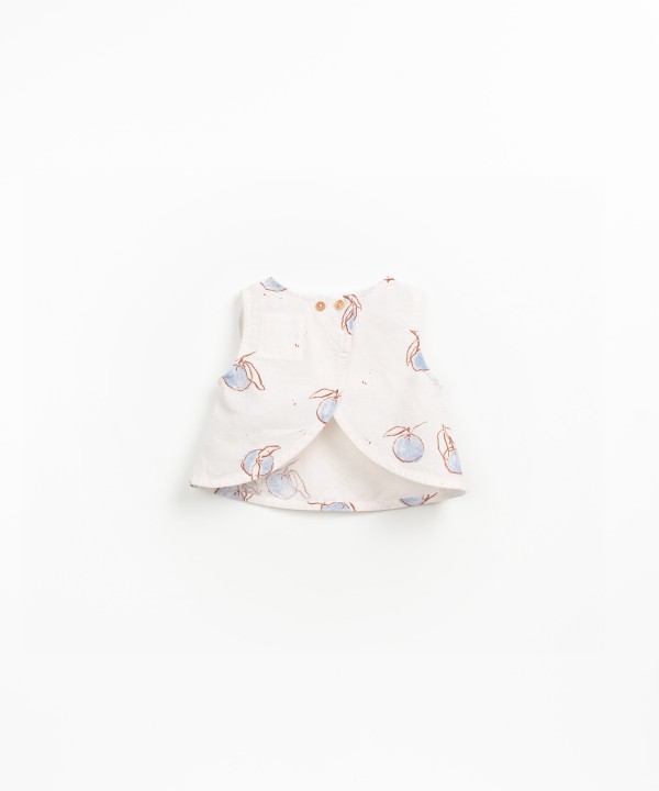 Sleeveless blouse with orange print