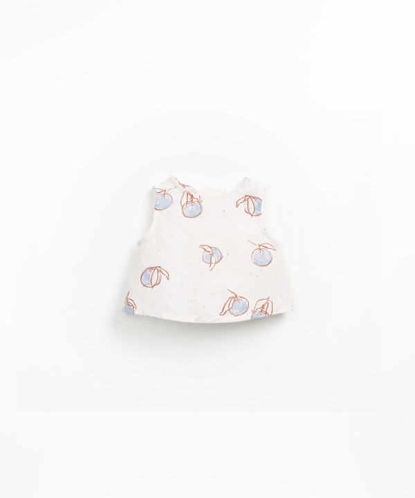 Sleeveless blouse with orange print