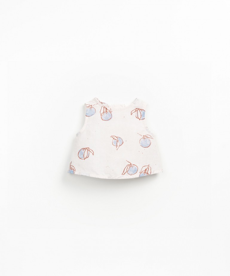 Sleeveless blouse with orange print