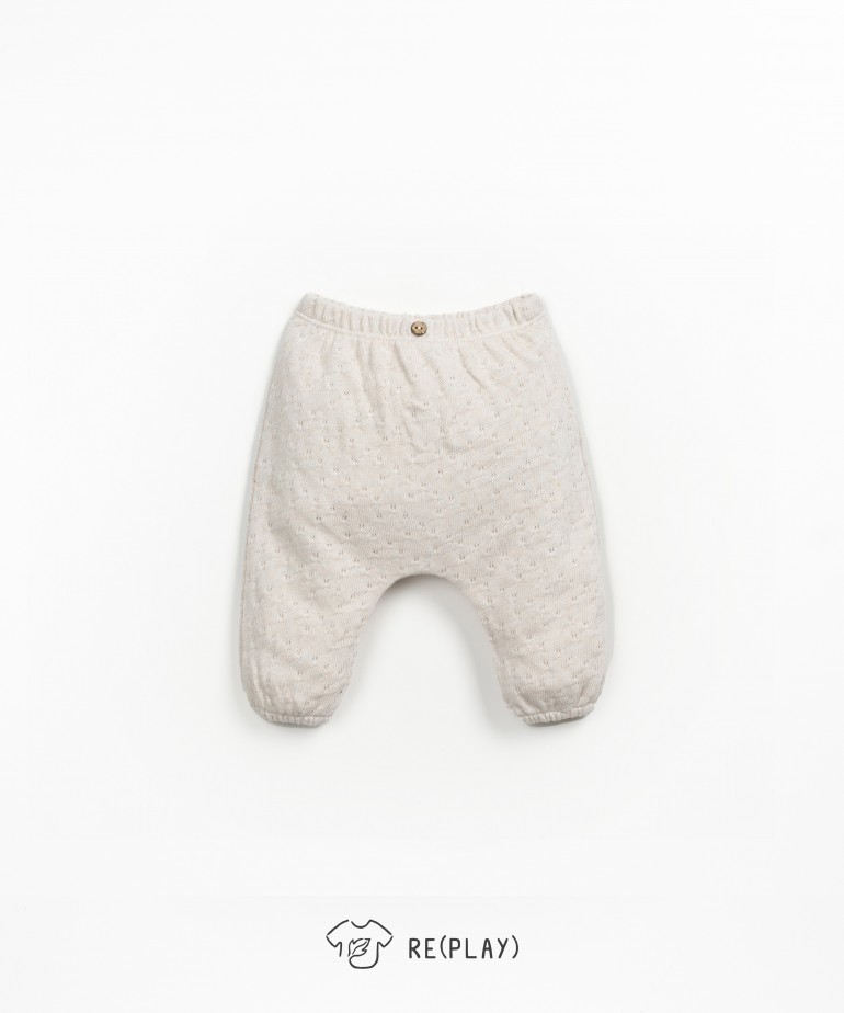 Trousers with elastic at the leg openings