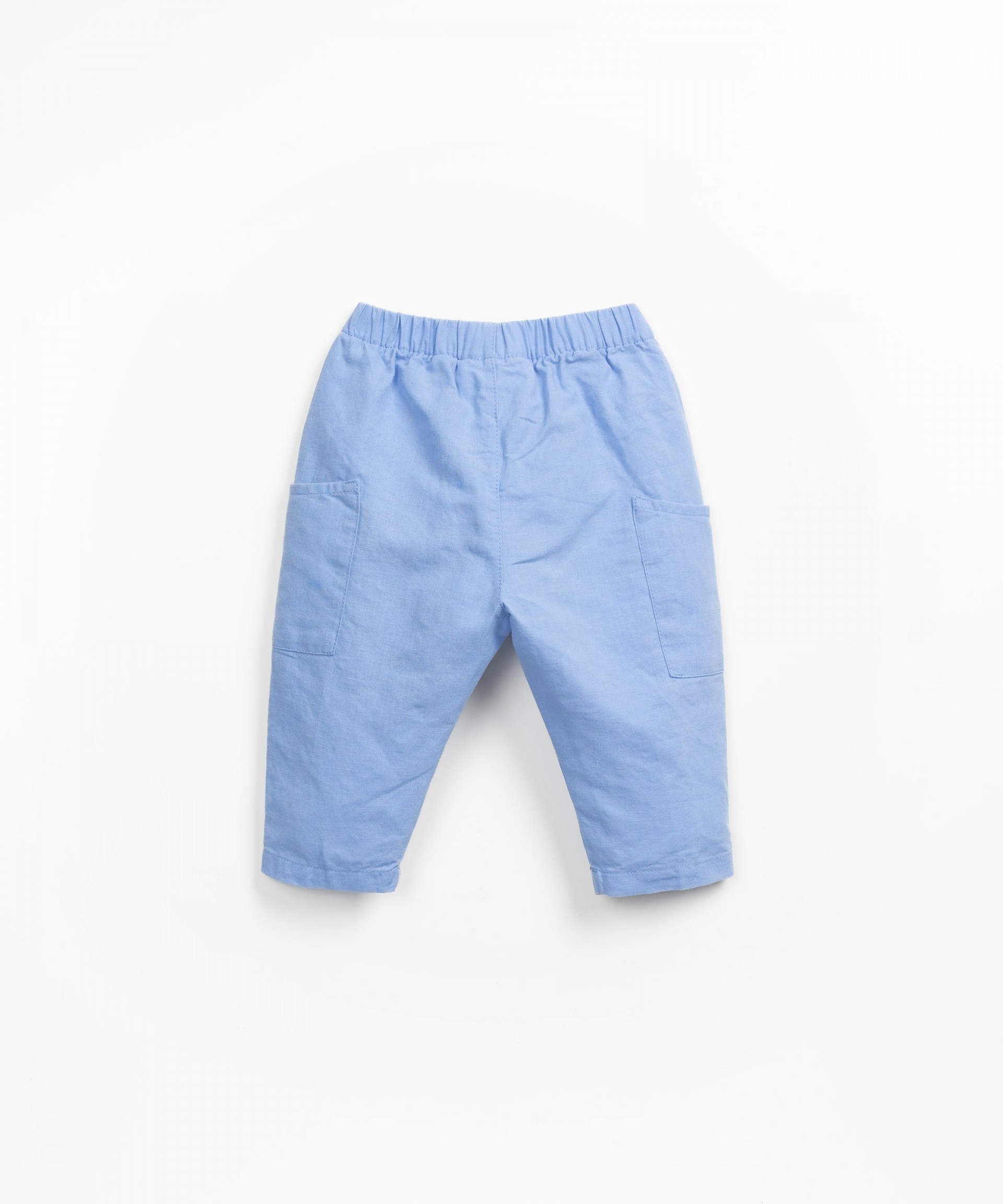 Fabric trousers with side pockets