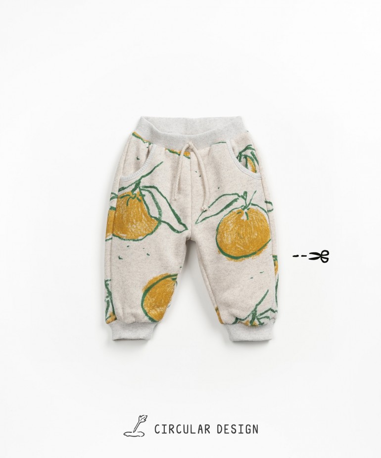 Fleece trousers with orange and leaf print