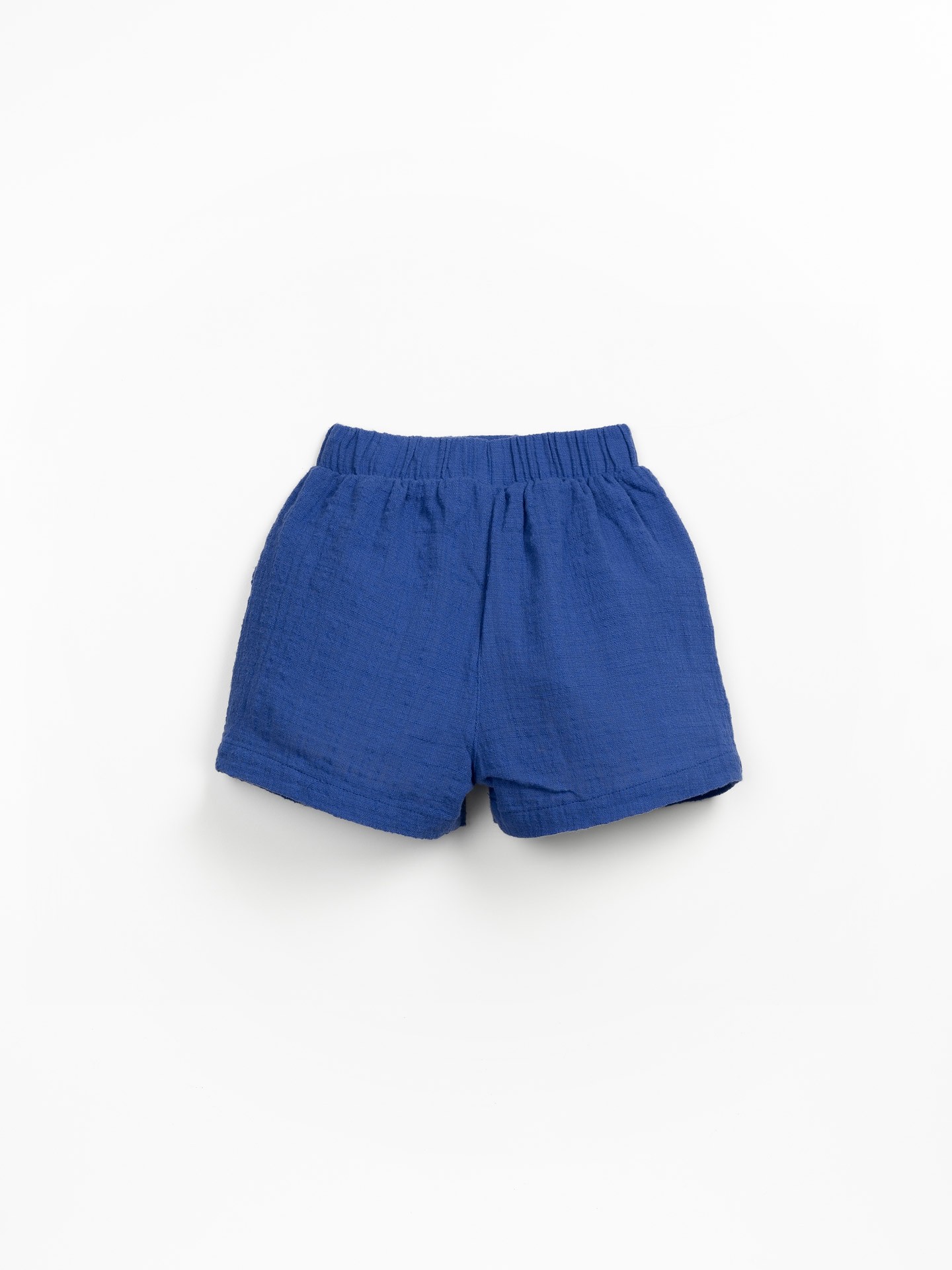 Calção de tecido com bolsos